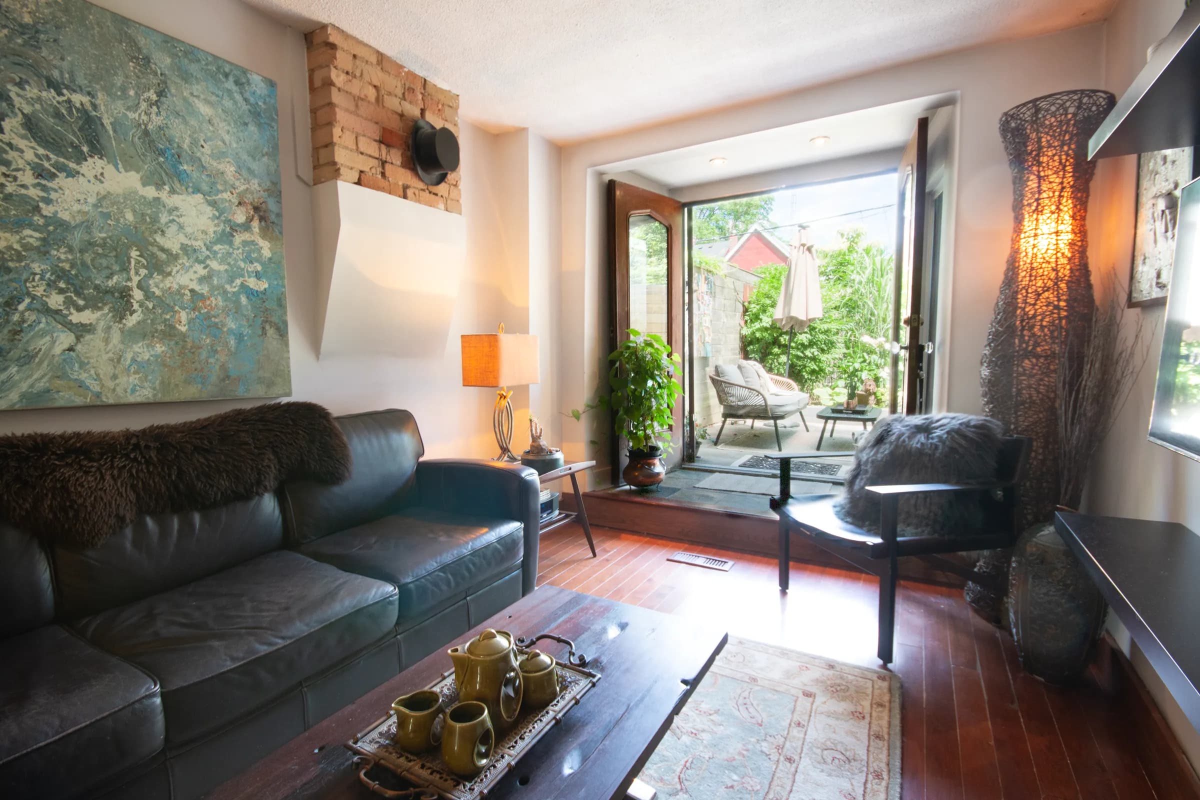 Stylish living space with exposed brick and modern furnishings