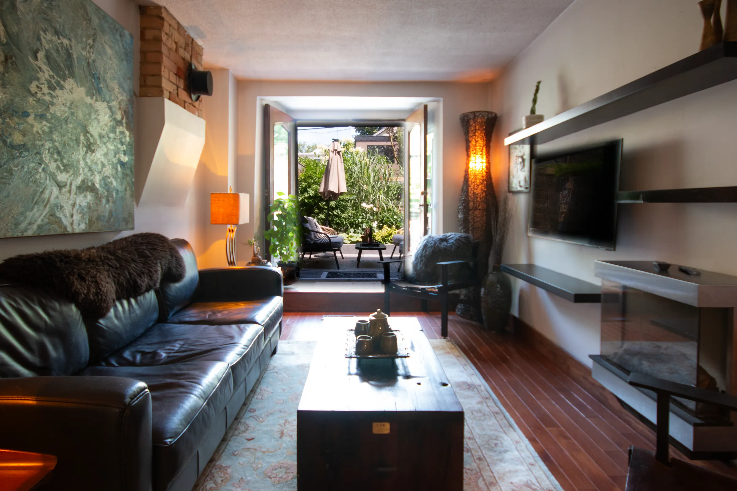 Warm living room opening onto a garden patio