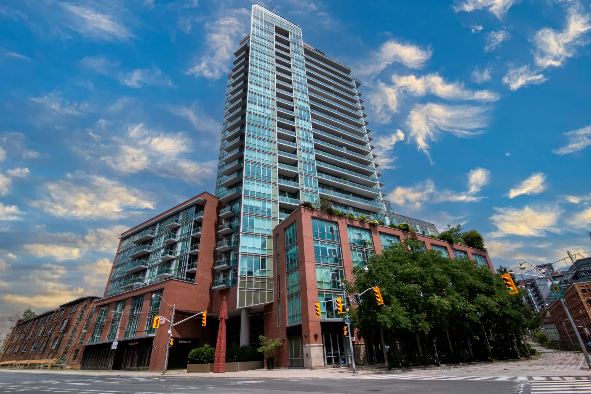 Daytime exterior of the VU Condos tower at George and Adelaide