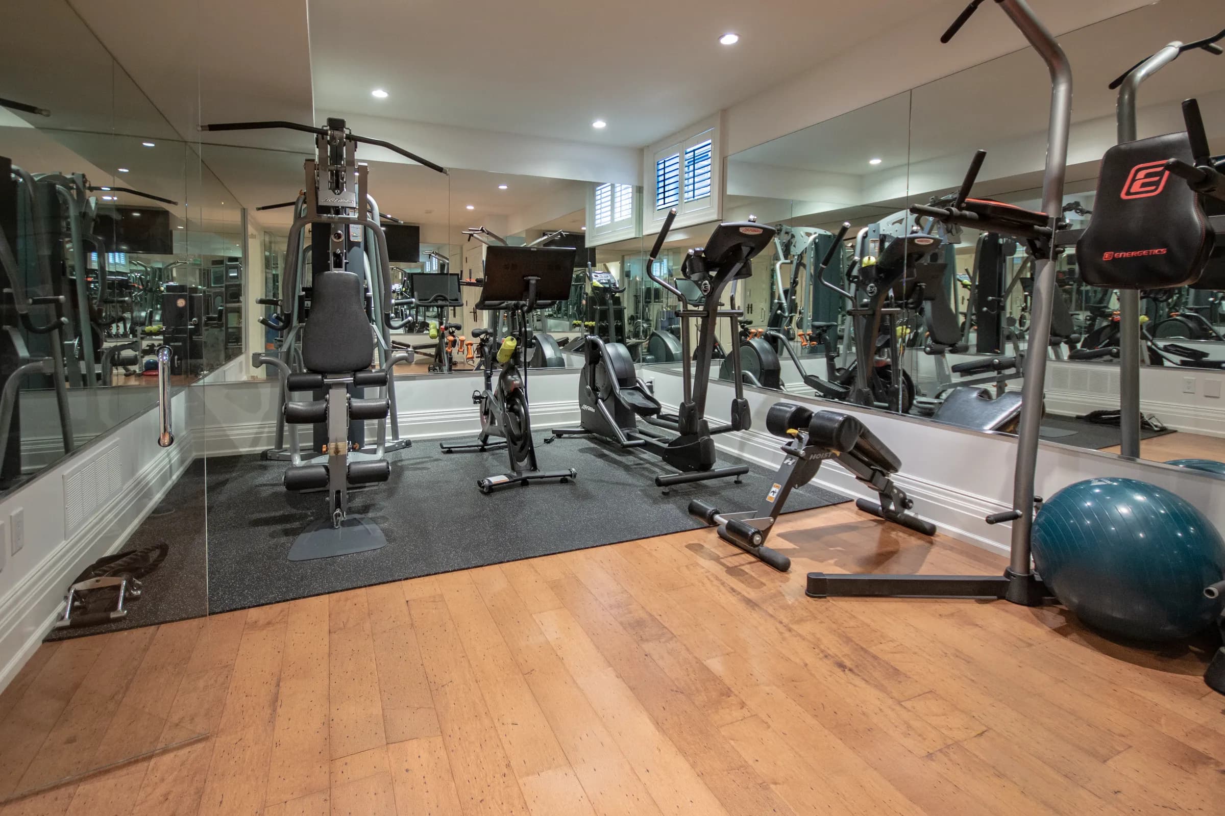 Home gym with rubber flooring and natural light