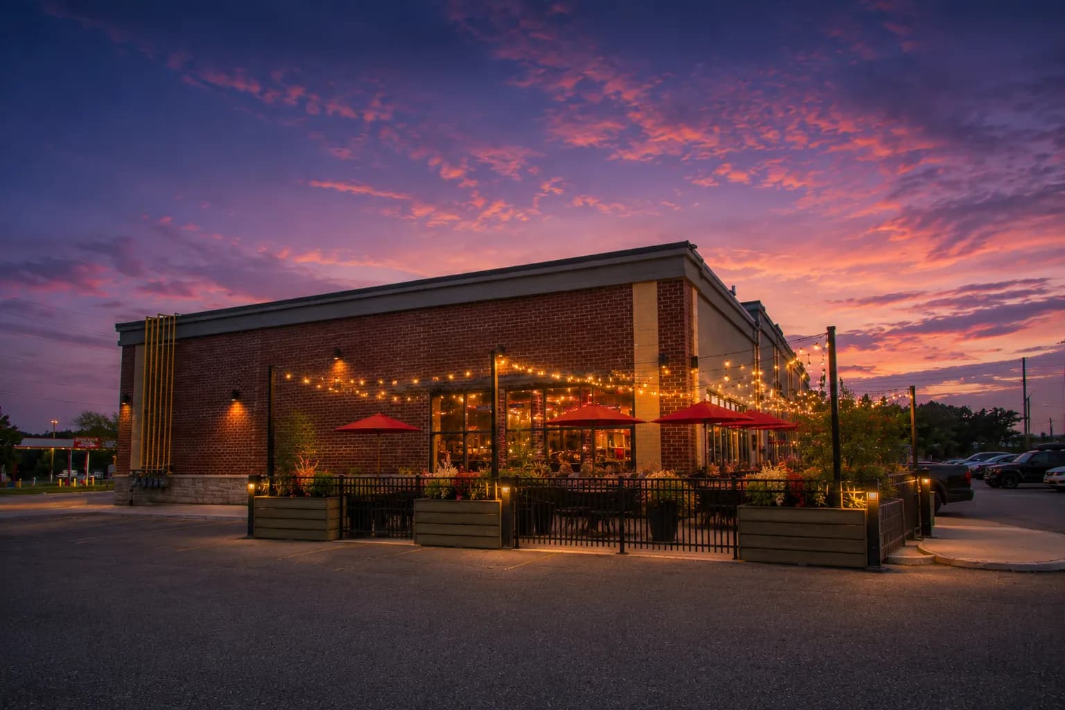 Plaza patio dining area glowing under twilight