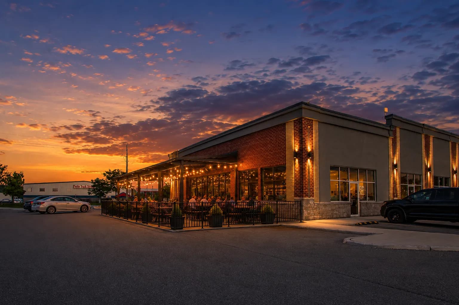Commercial plaza patio glowing at twilight, DS Realty Media